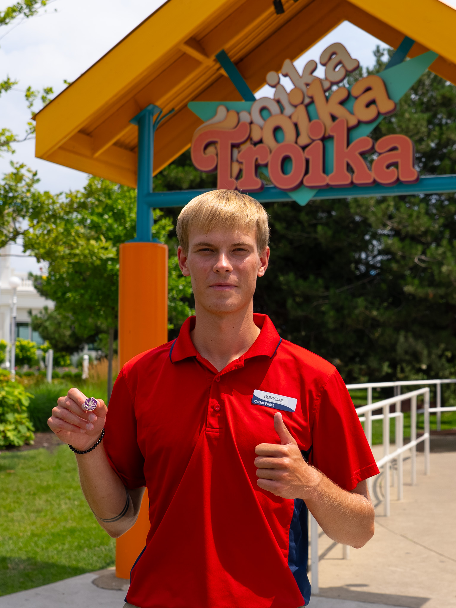 Dovydas holds a Golden Thumb award at Cedar Point
