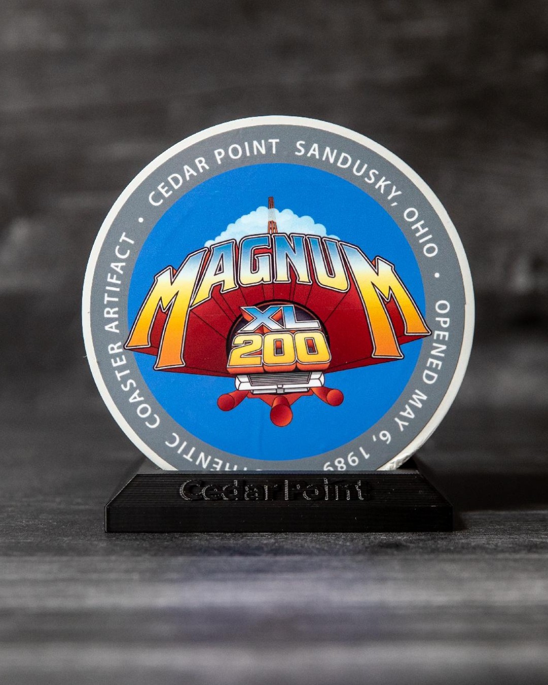 Magnum XL-200 track slice display piece on a black Cedar Point base