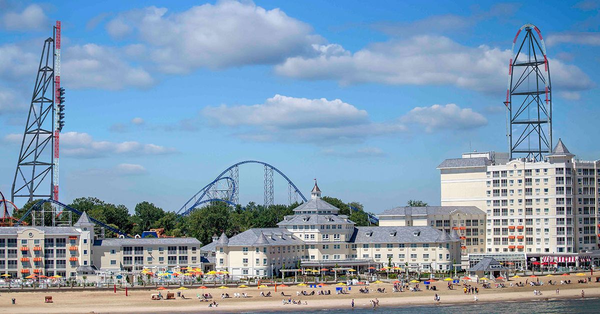 Cedar Point resort guests walk near a Lake Erie hotel setting