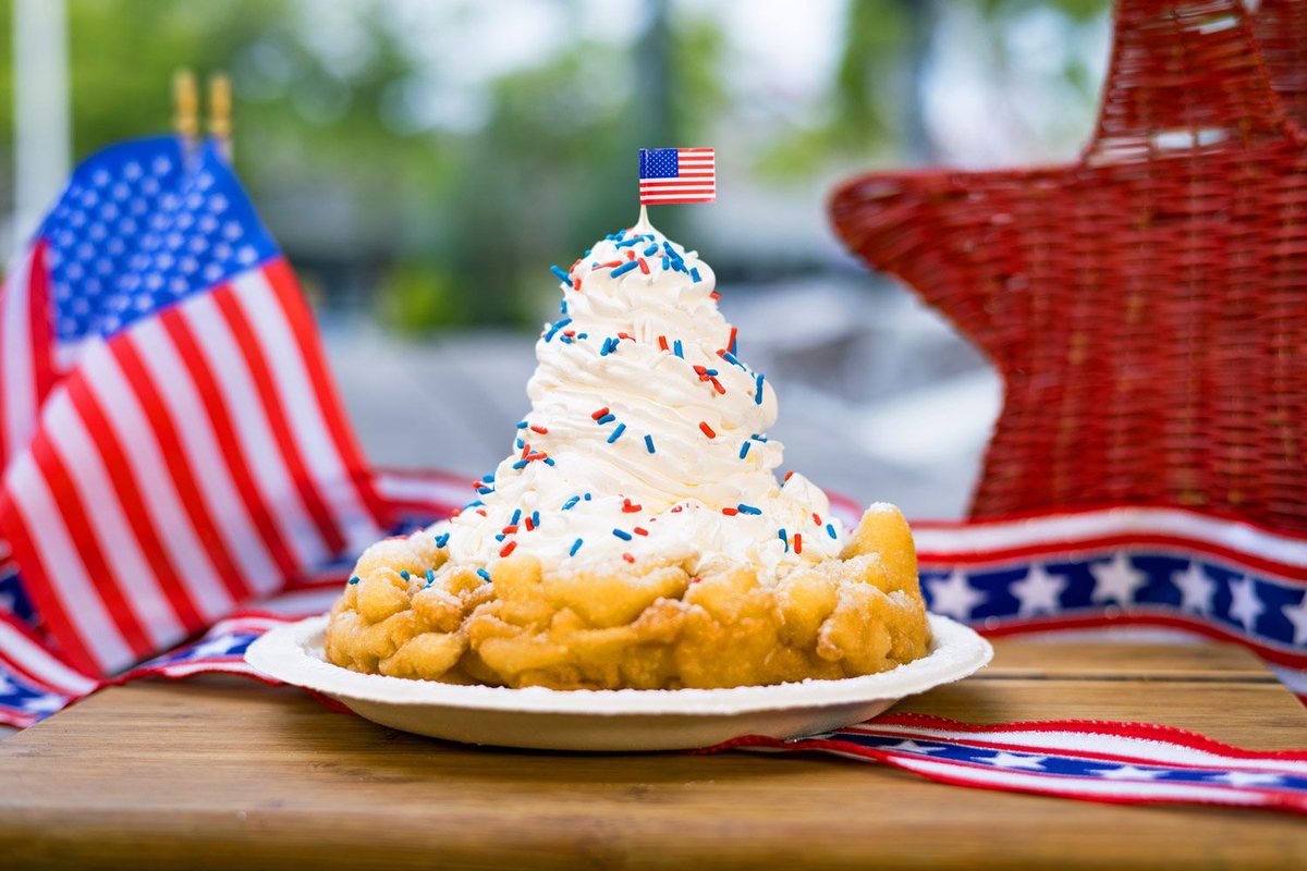 All American Funnel Cake topped with vanilla ice cream and red, white and blue sprinkles