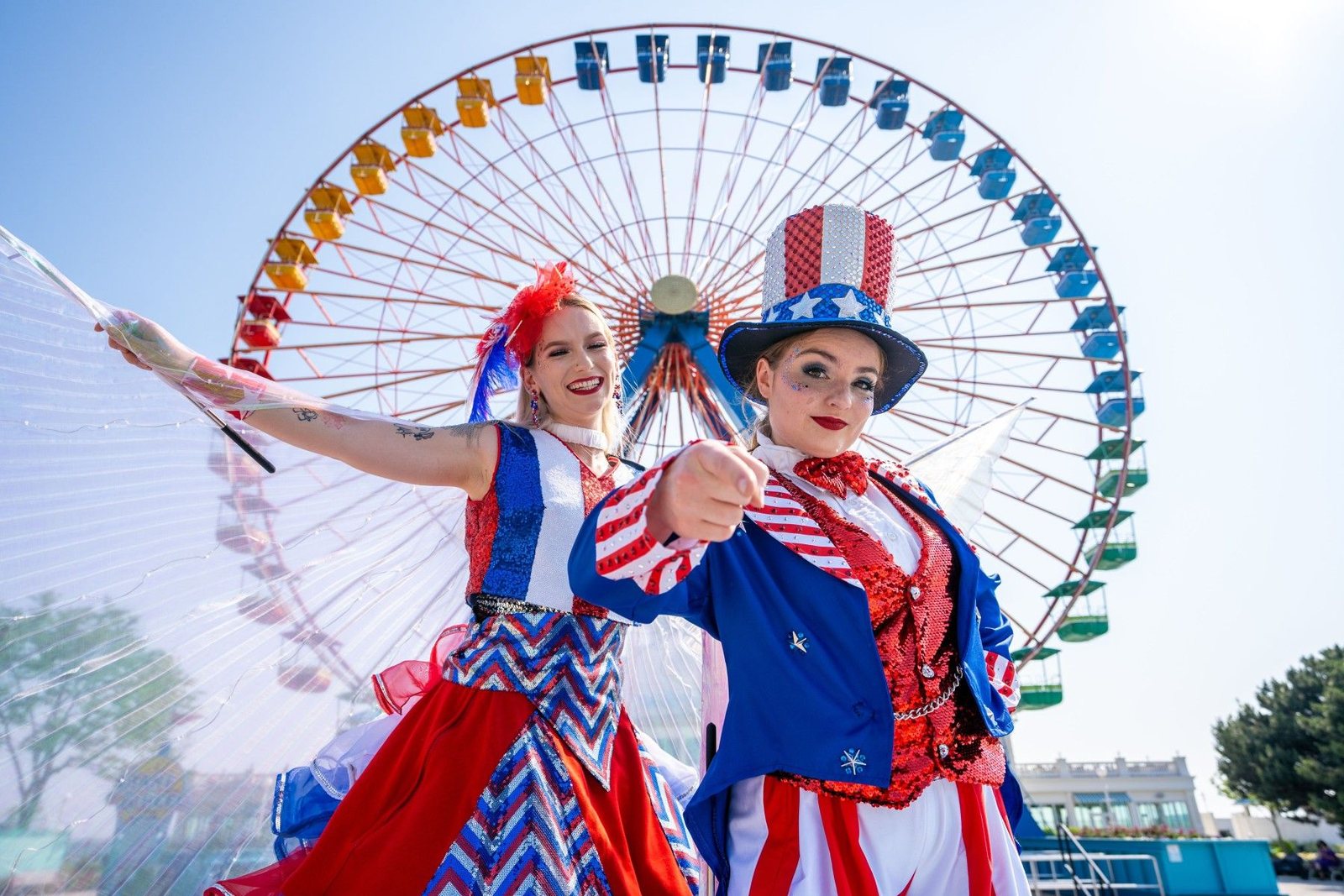 Patriotic performers pose in front of the Cedar Point Giant Wheel