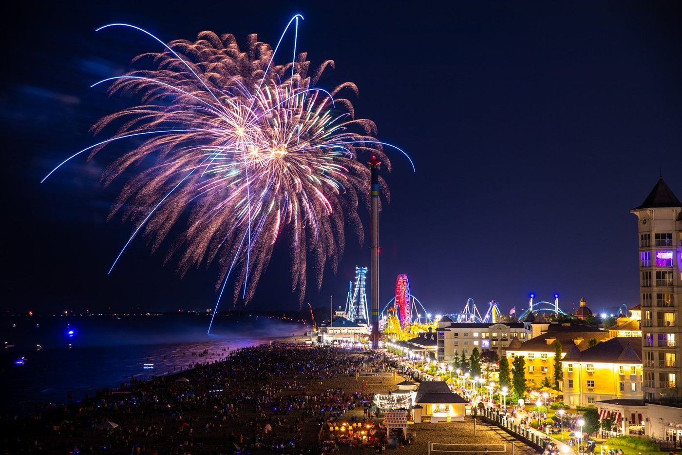 Fireworks burst over Cedar Point during a summer celebration