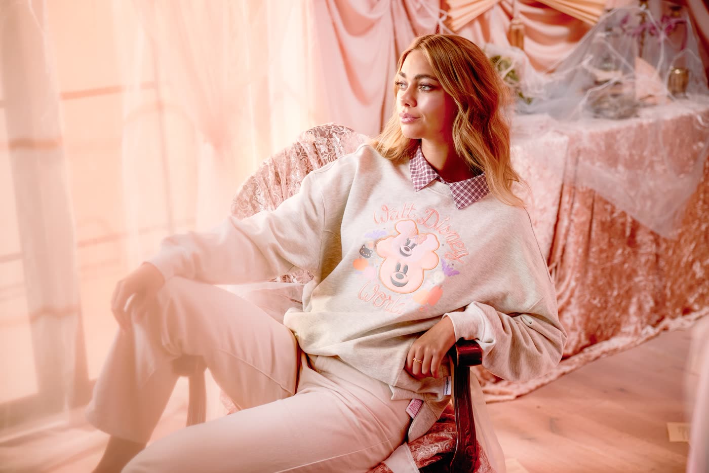 Model wearing a purple Disney Cutie Ghost crewneck sweatshirt