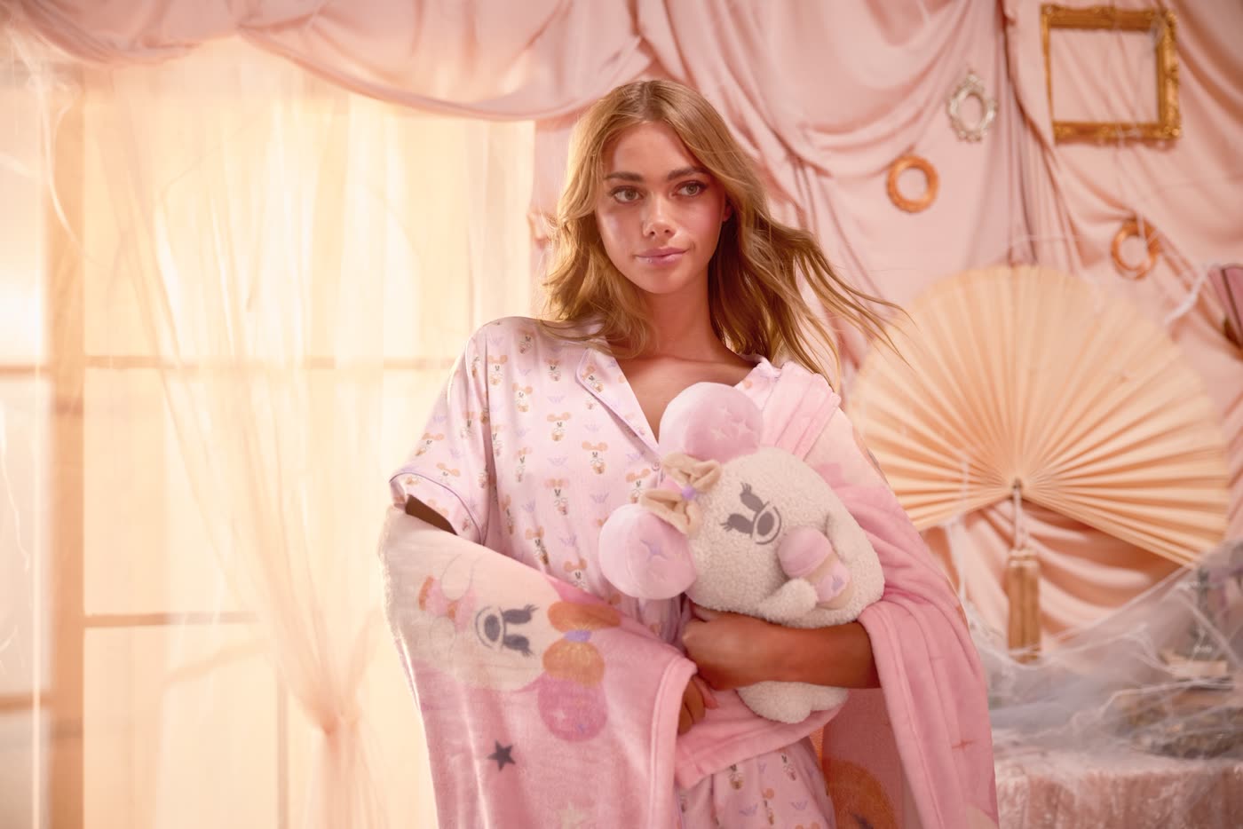 Model holding a Disney Cutie Ghost plush pillow