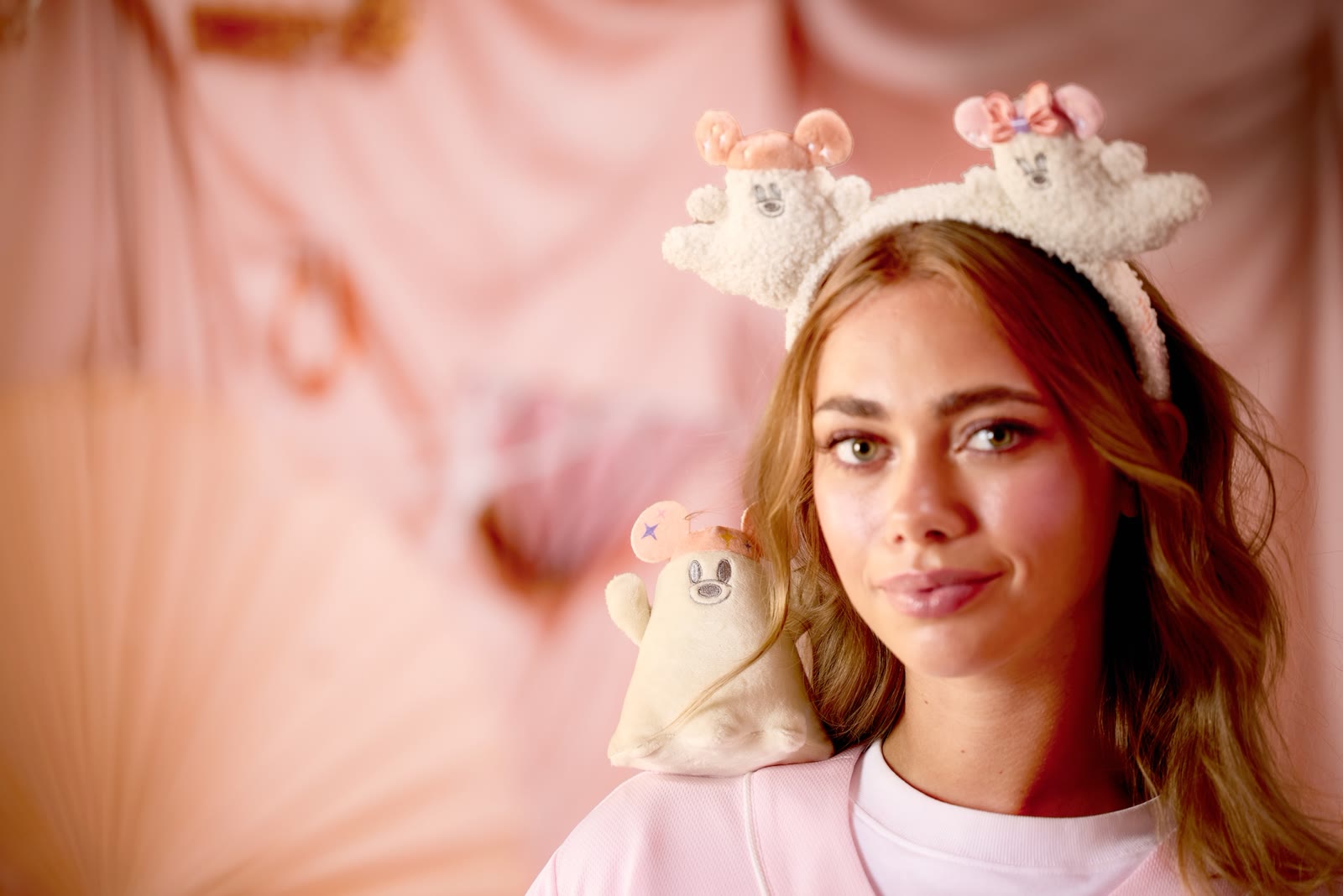 Model wearing a pastel Disney Cutie Ghost ear headband