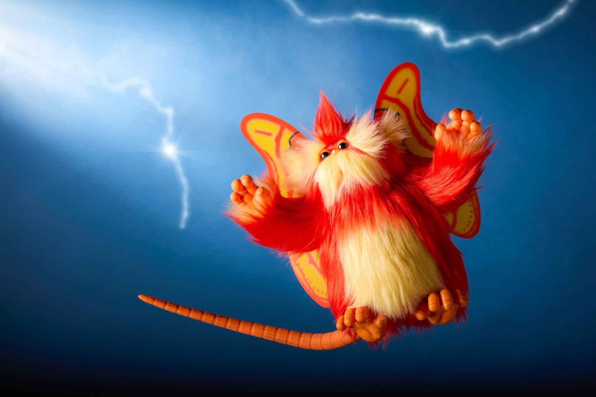 Interactive orange Fuzzball plush from Captain EO
