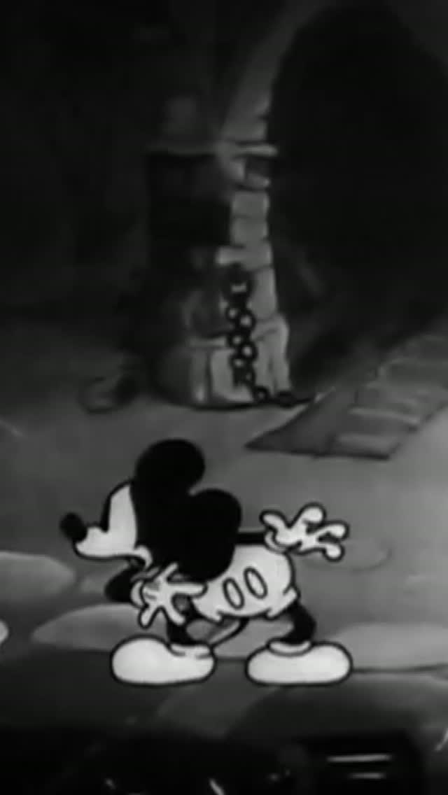 Mickey Mouse in a black-and-white Halloween scene from D23’s prize-pack reel