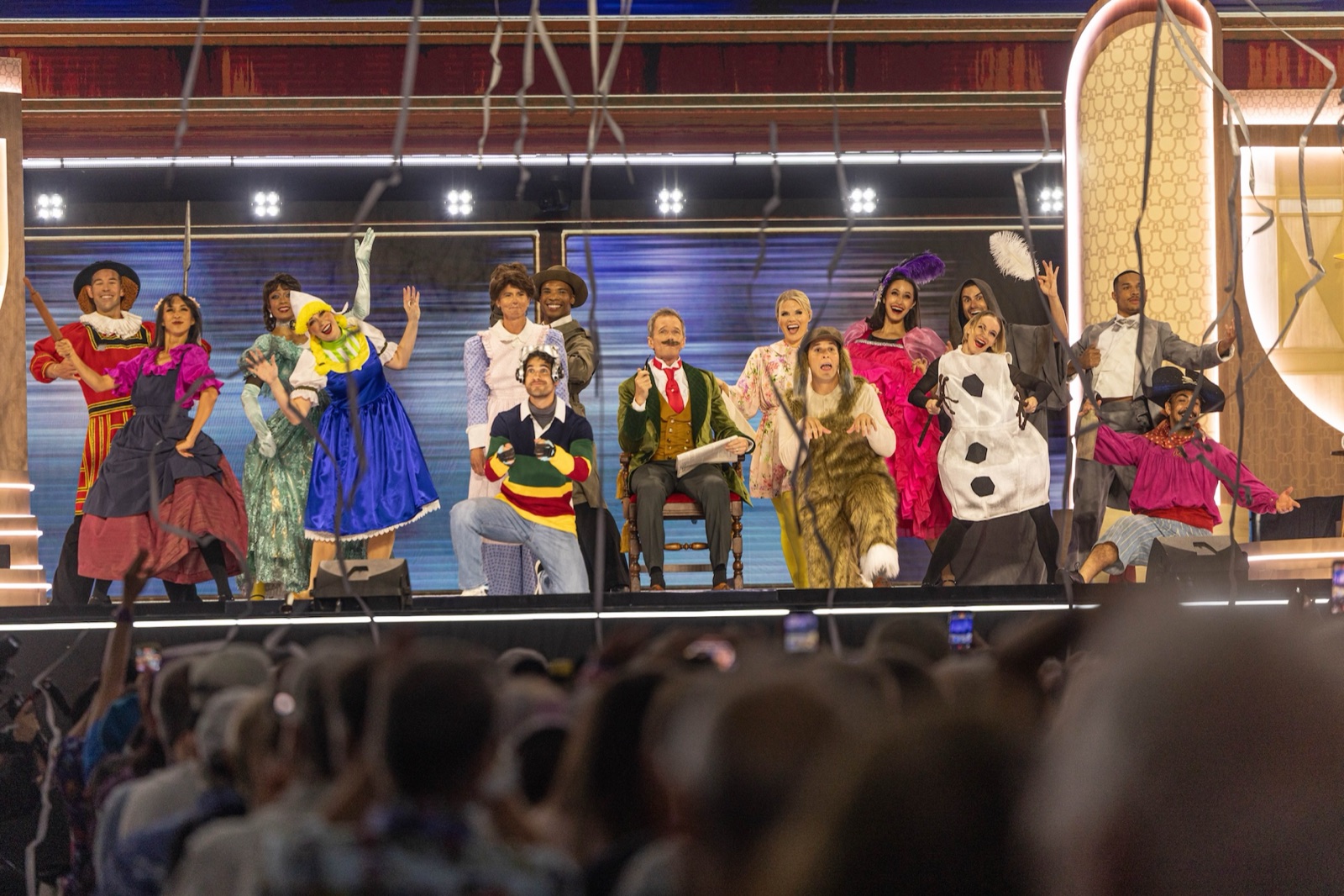 The D23 opening-number cast poses as Disney attraction characters