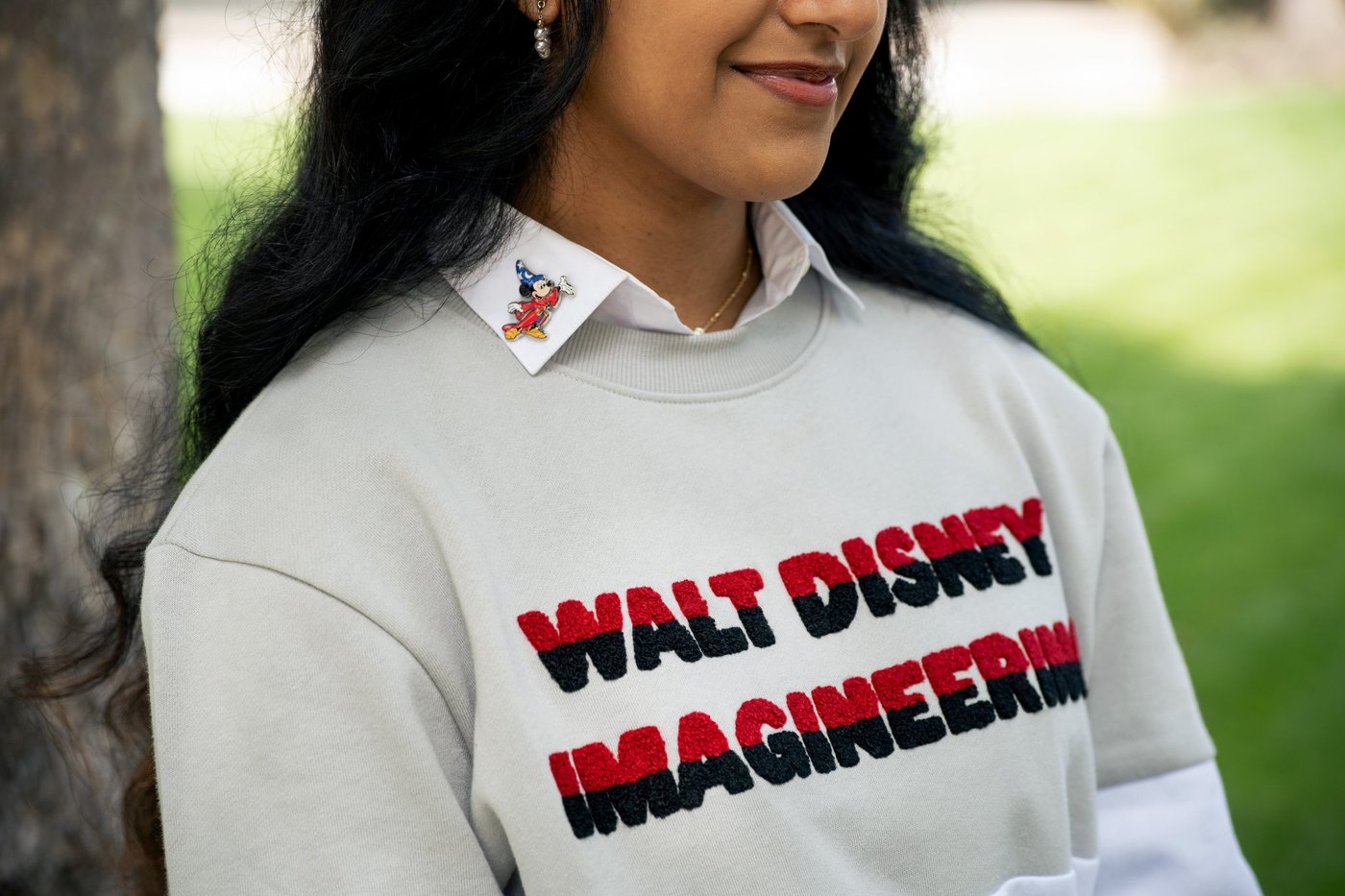 Walt Disney Imagineering sweatshirt with Sorcerer Mickey collar pin