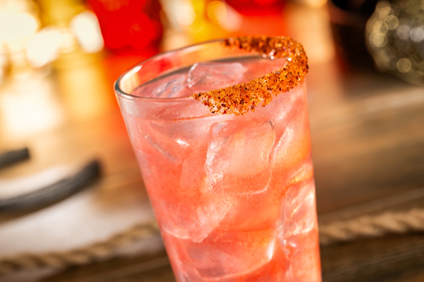 Enchanting Ember Lemonade with strawberry, hot honey and a chili-lime rim