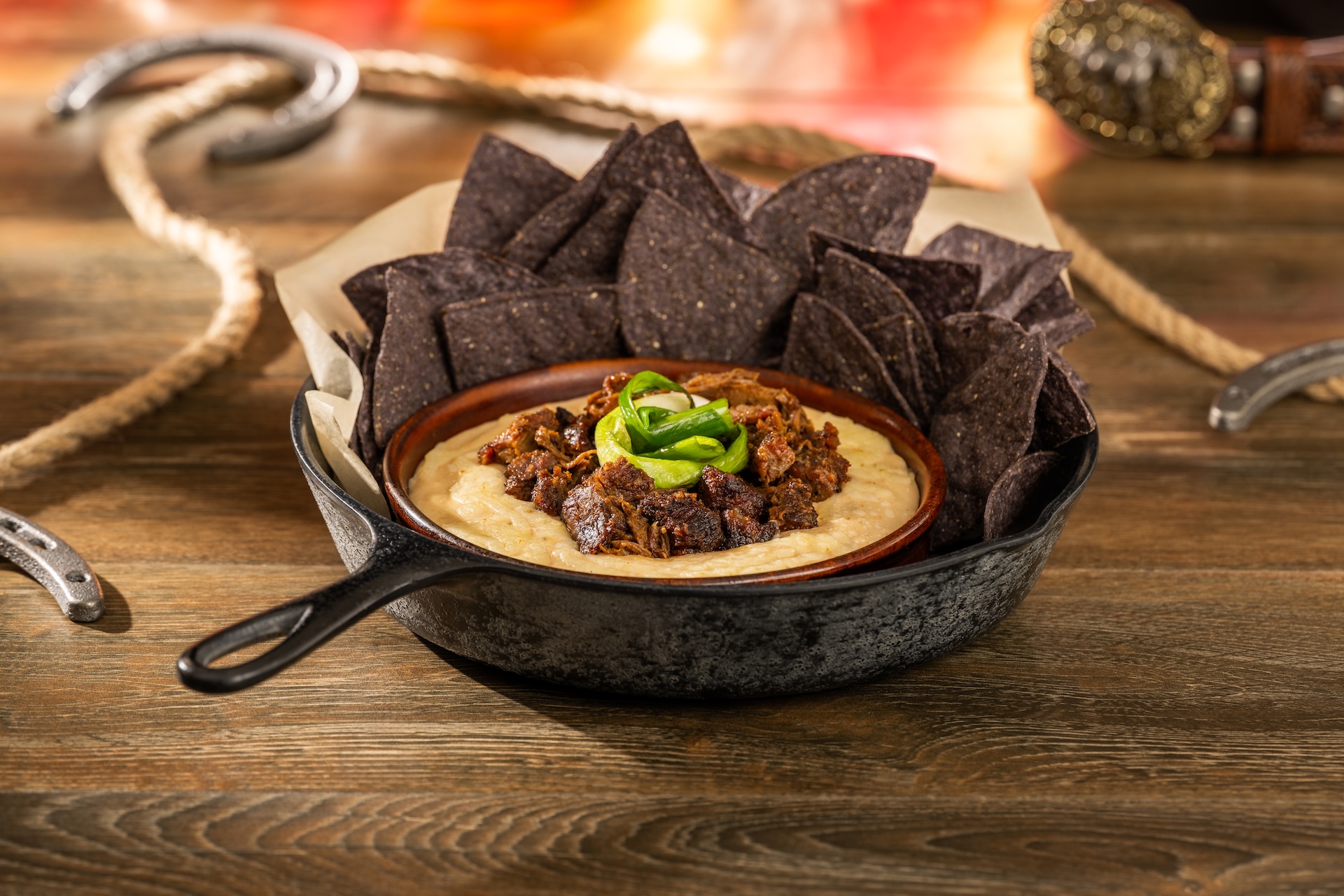 Queso fundido with barbecue burnt ends and tortilla chips