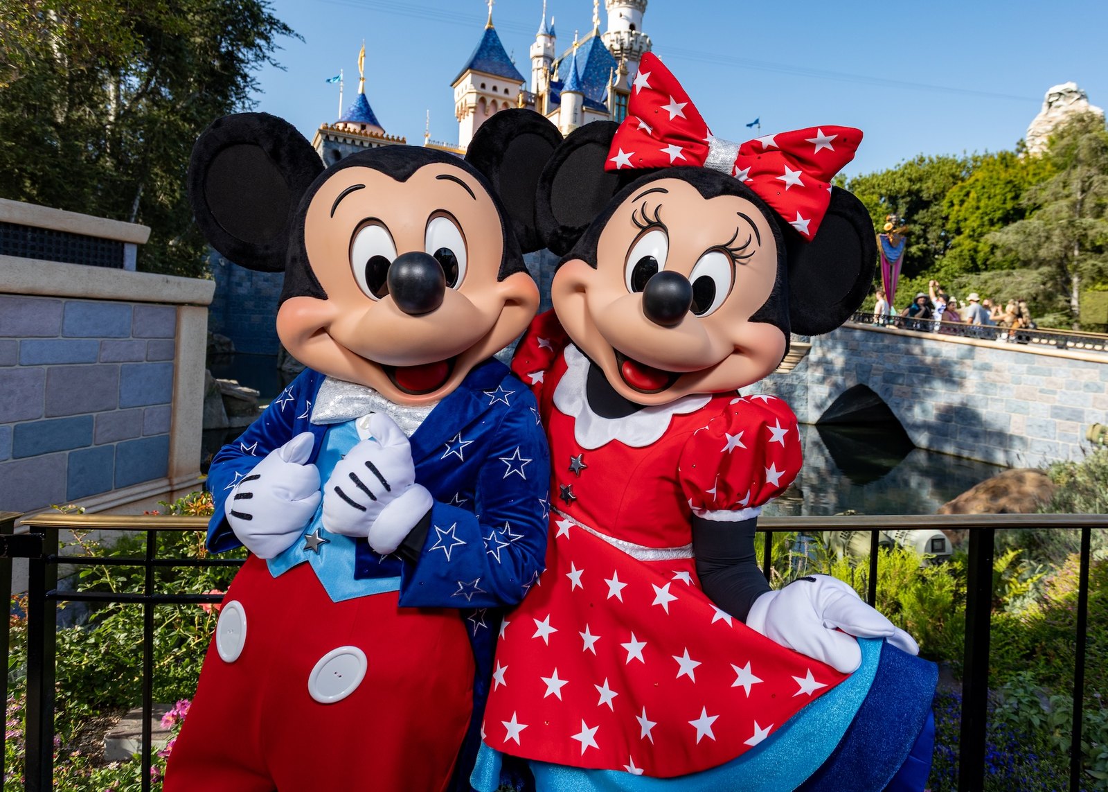 Mickey Mouse and Minnie Mouse in patriotic outfits at Magic Kingdom