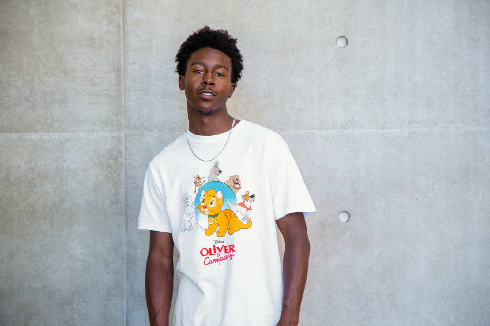 White Oliver and Company shirt with Oliver and Dodger