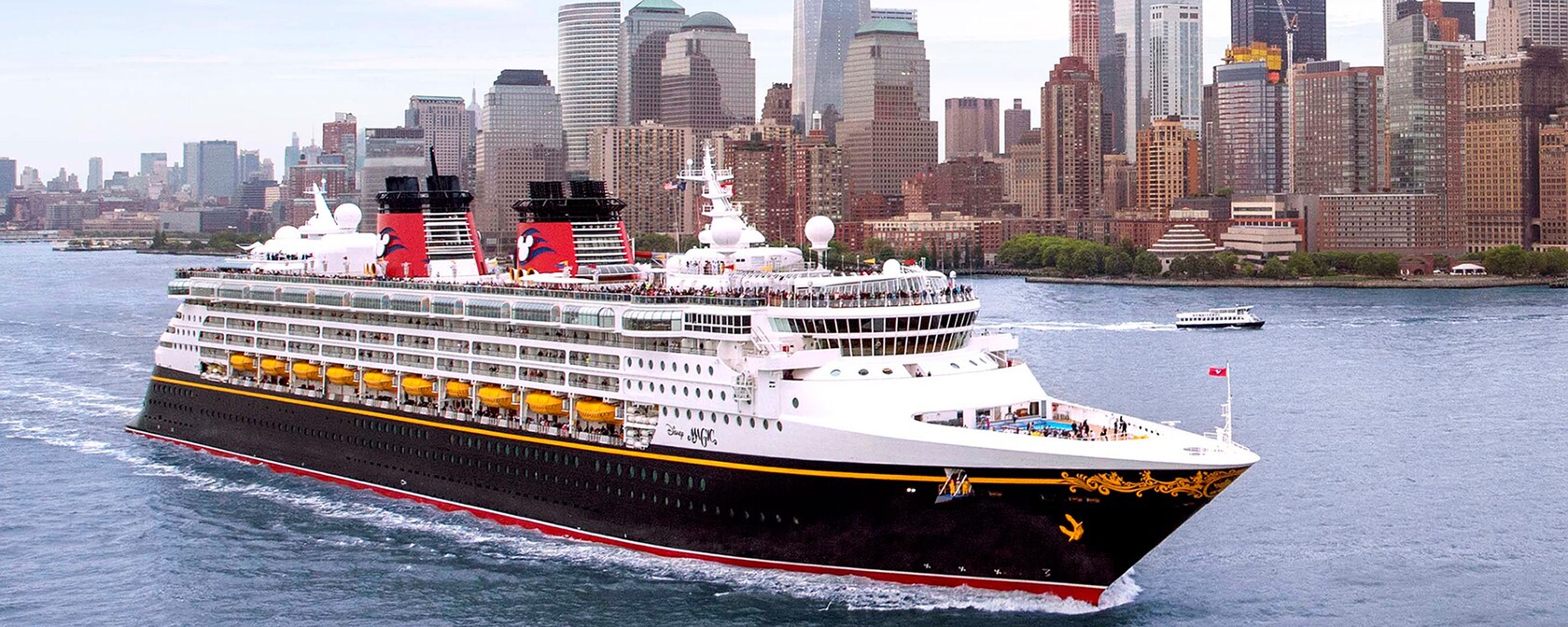 Disney Cruise Line ship sailing past the Lower Manhattan skyline