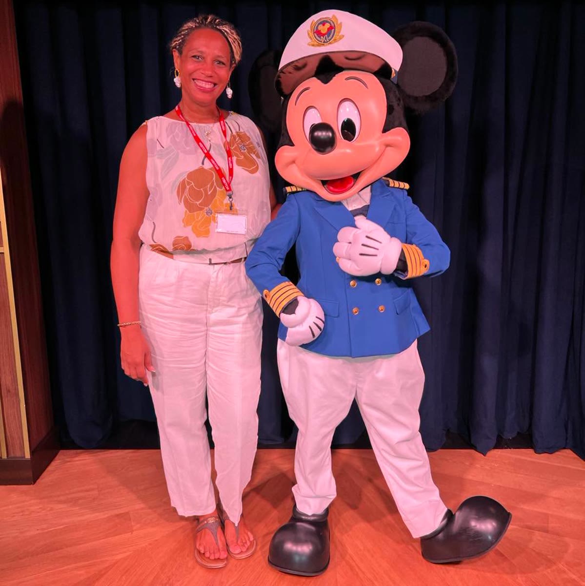 Mickey Mouse in a Disney Cruise Line captain outfit with St. Maarten tourism minister Grisha Heyliger-Marten
