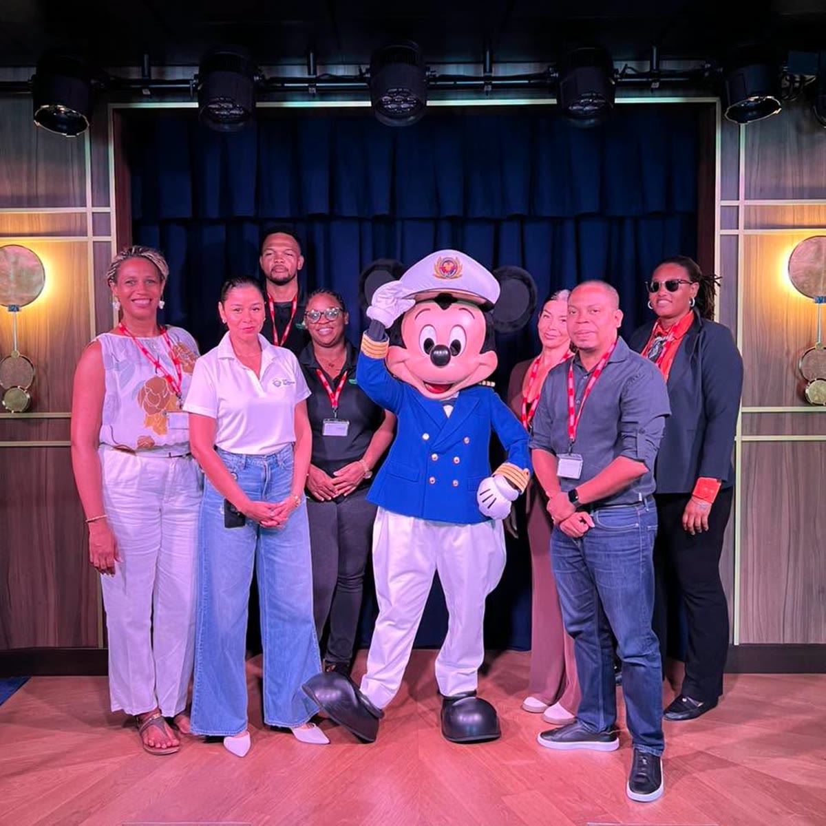 Mickey Mouse in a Disney Cruise Line captain outfit with St. Maarten officials aboard Disney Destiny