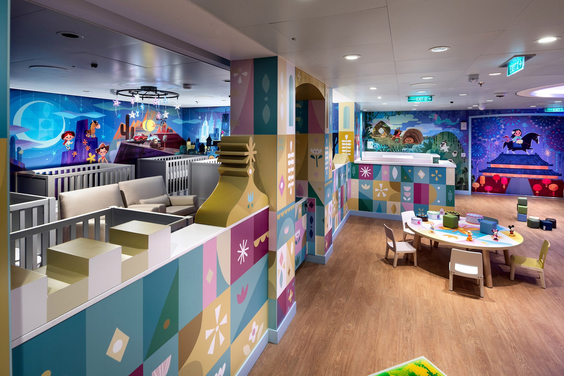 It’s a Small World Nursery aboard the Disney Destiny, with cribs and a play table