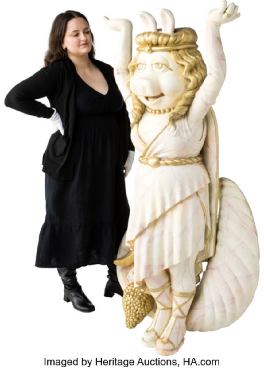 Park-used Miss Piggy theater figure beside a person for scale