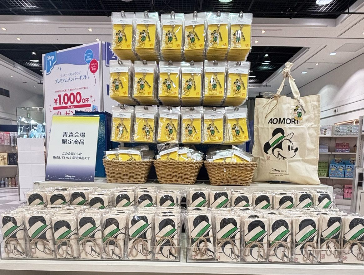 Disney Flagship Tokyo Aomori product table with plush characters and local items