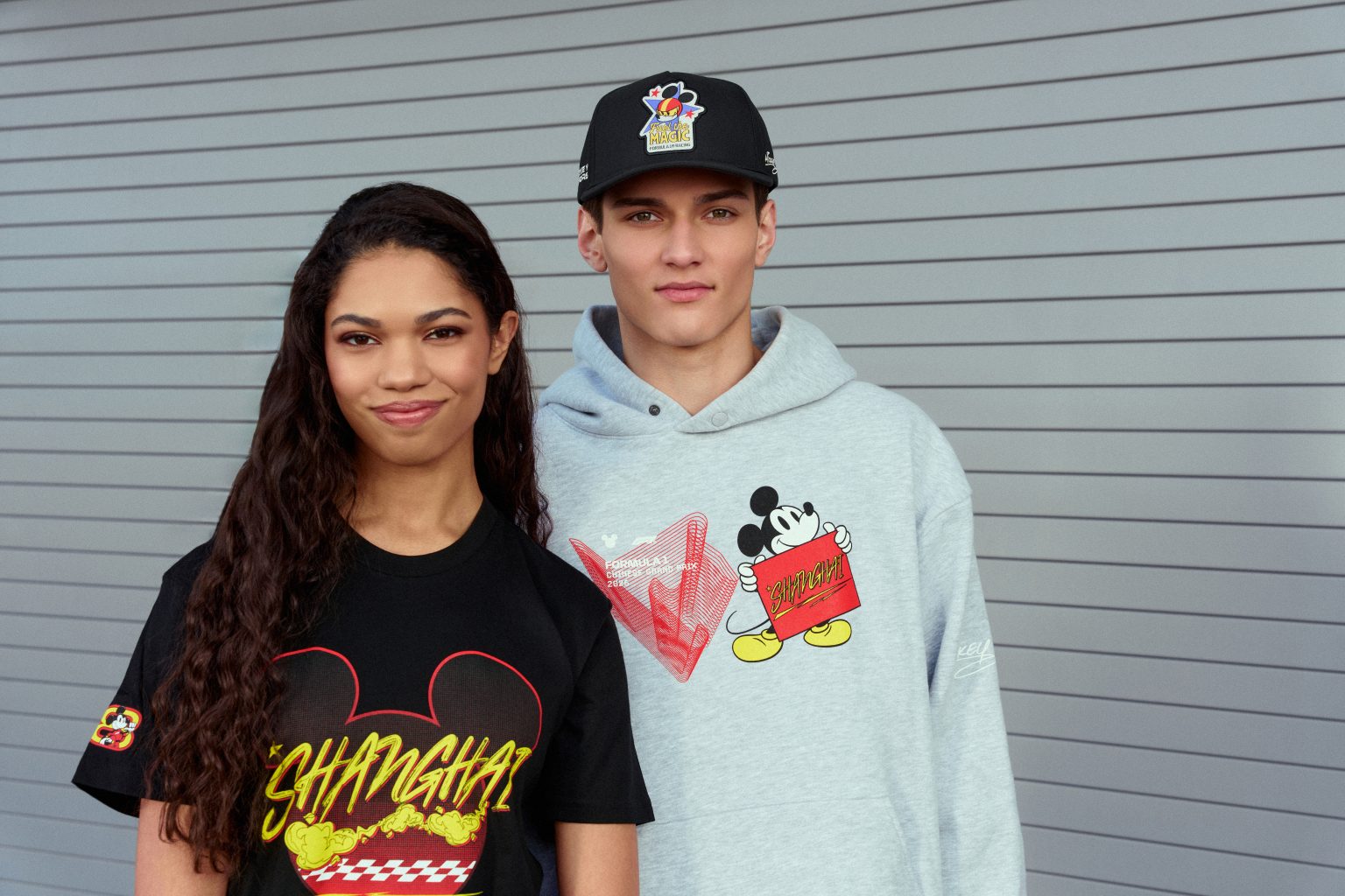 Models wearing official Disney and Formula 1 apparel