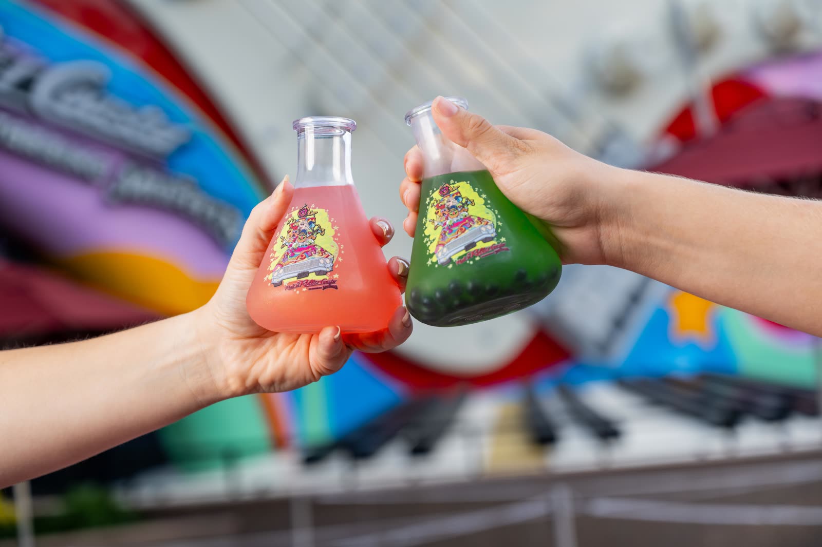 Pink and green drinks in Muppets lab flask novelty cups at Disney's Hollywood Studios