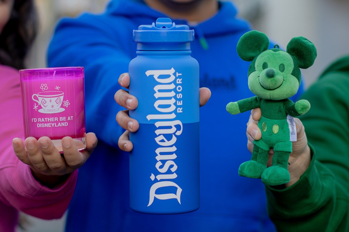 Pink Disneyland tumbler, blue Disneyland Resort bottle, and green Mickey plush from the Disney Parks Logo Mania Collection