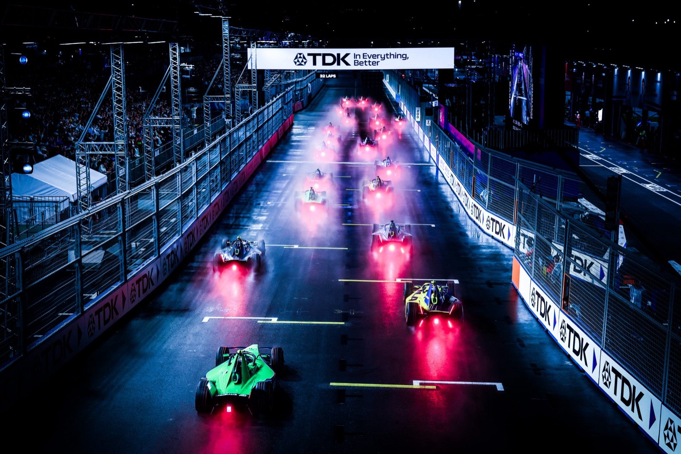 Formula E cars race on a city street circuit