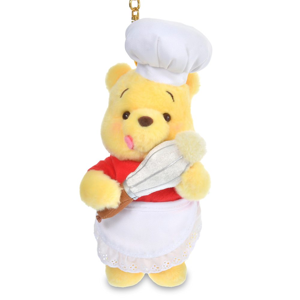 Pooh chef plush keychain holding a spatula