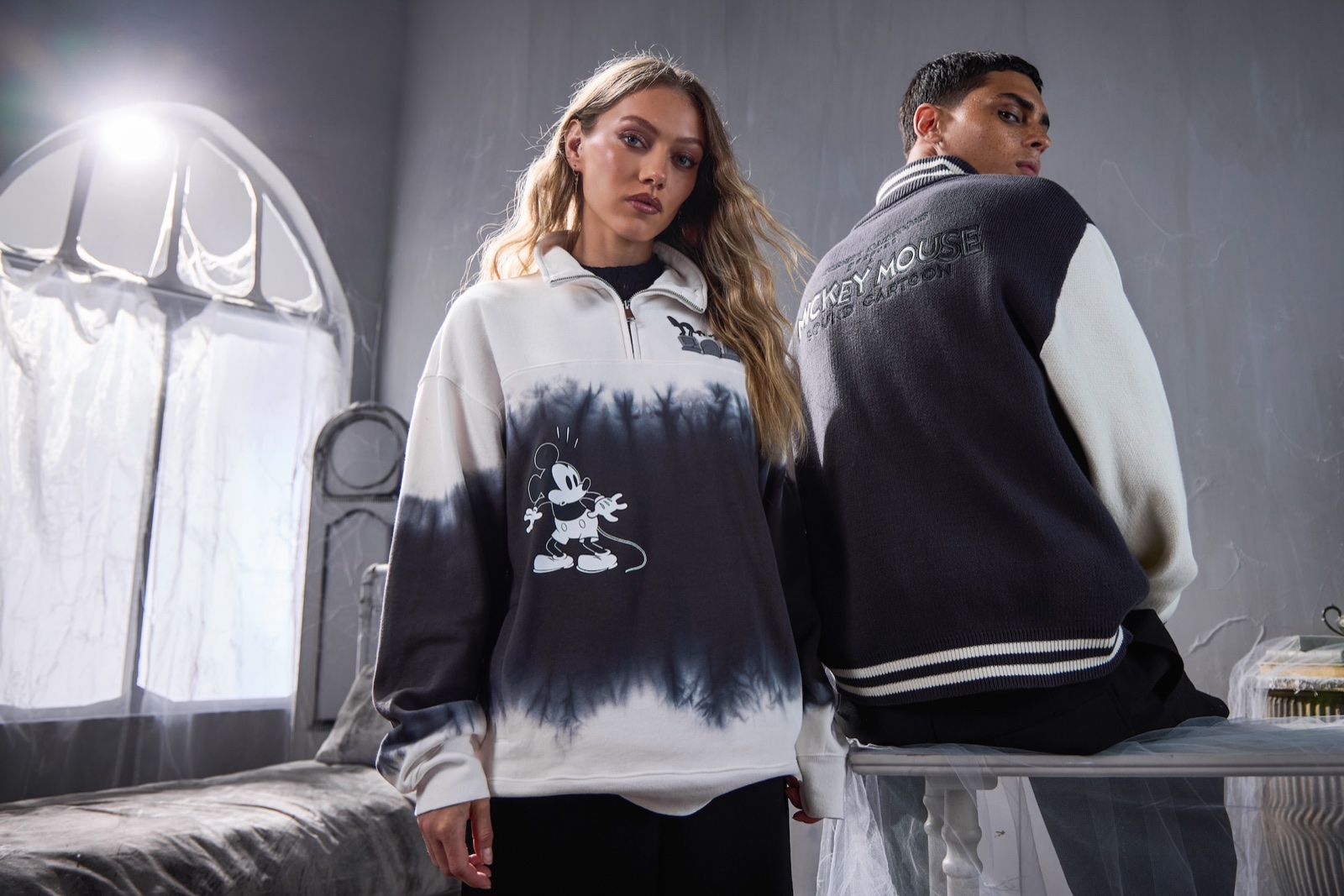Models wearing apparel from Disney Store's Skeleton Dance Halloween collection