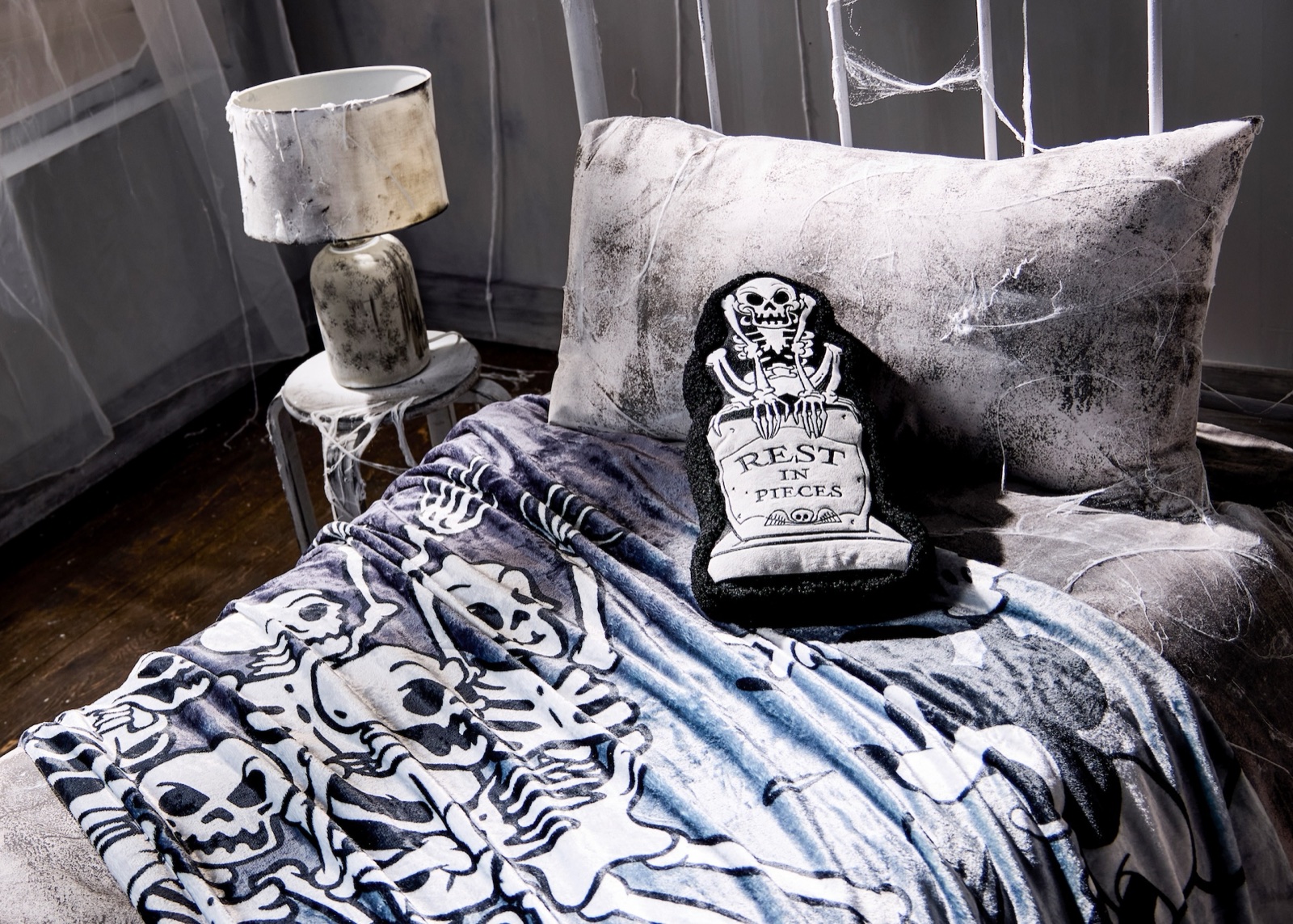 The Skeleton Dance home décor and light-up figure displayed on a bed