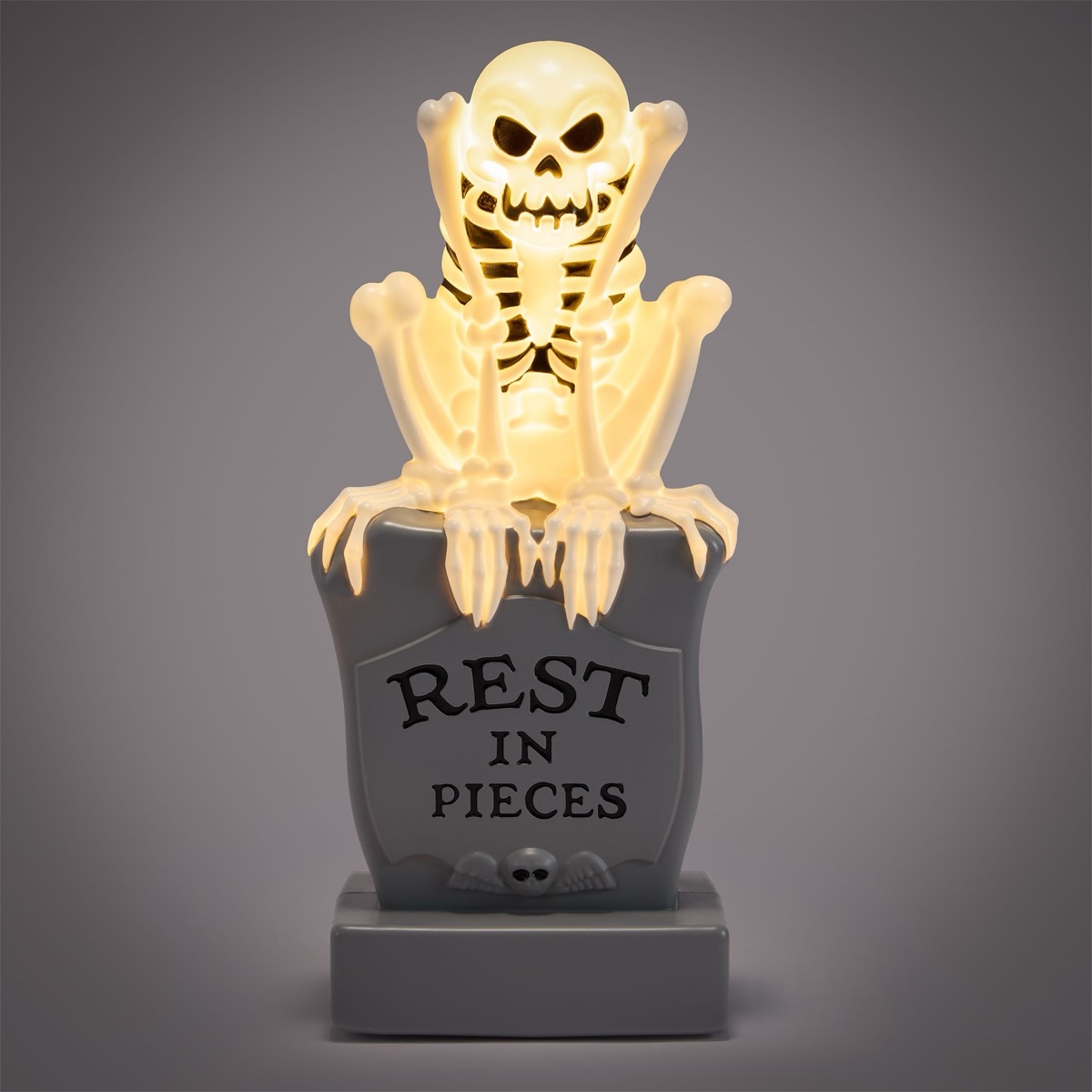 The Skeleton Dance light-up figure perched on a tombstone
