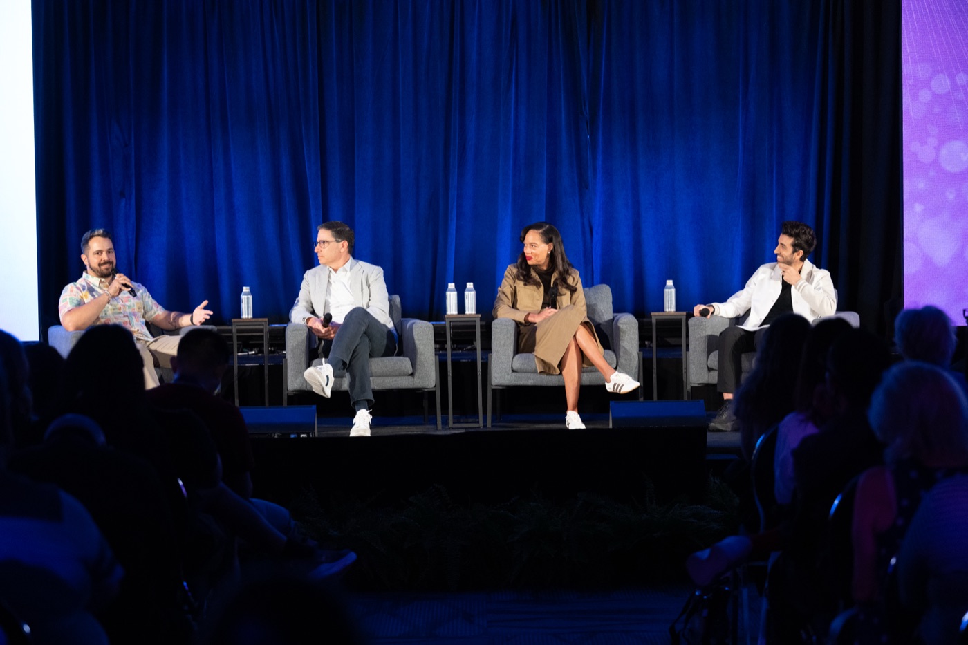 Two speakers discuss streaming strategy on the D23 stage