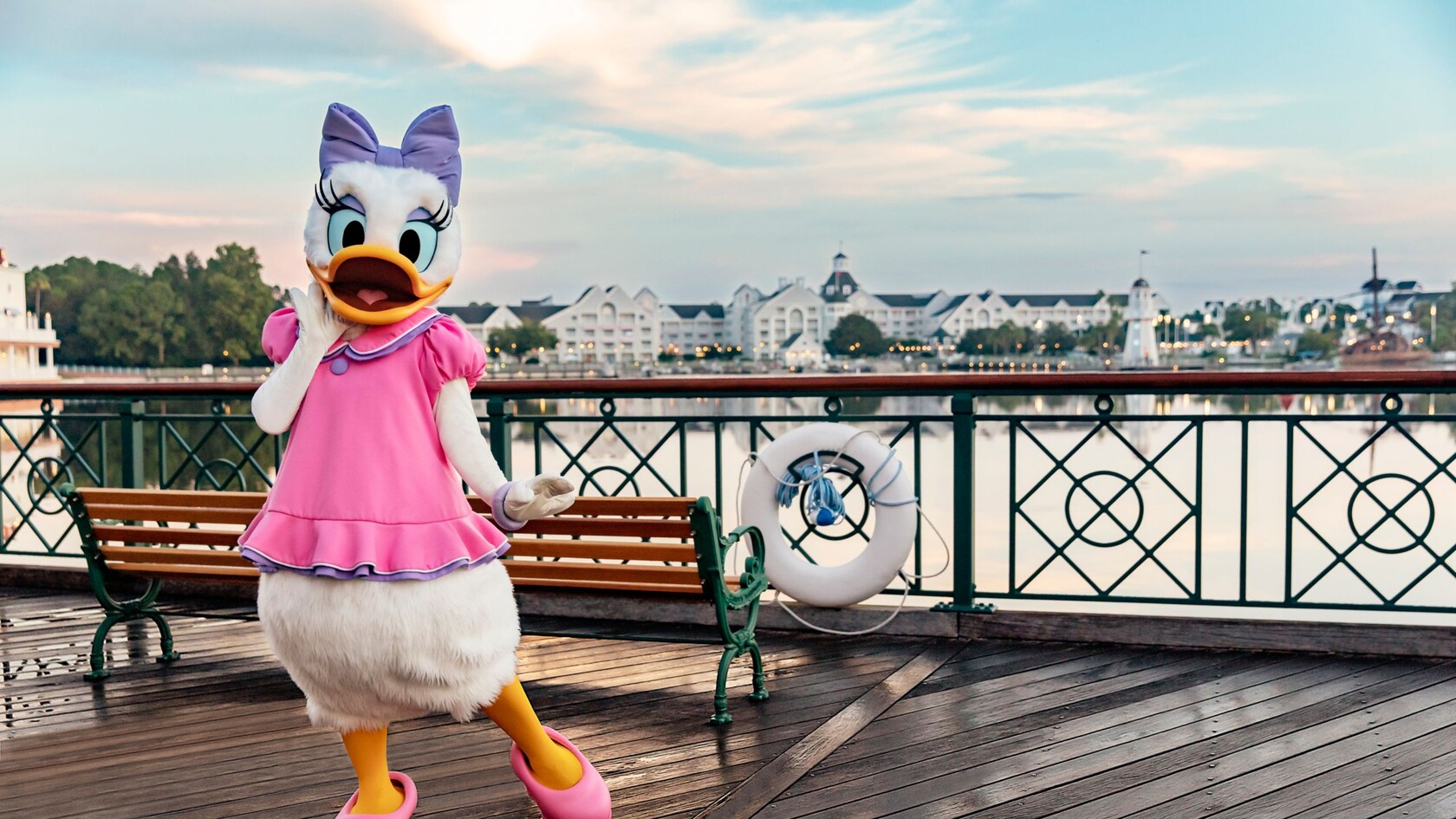 Daisy Duck stands beside the waterfront at Disney’s Yacht and Beach Club Resorts