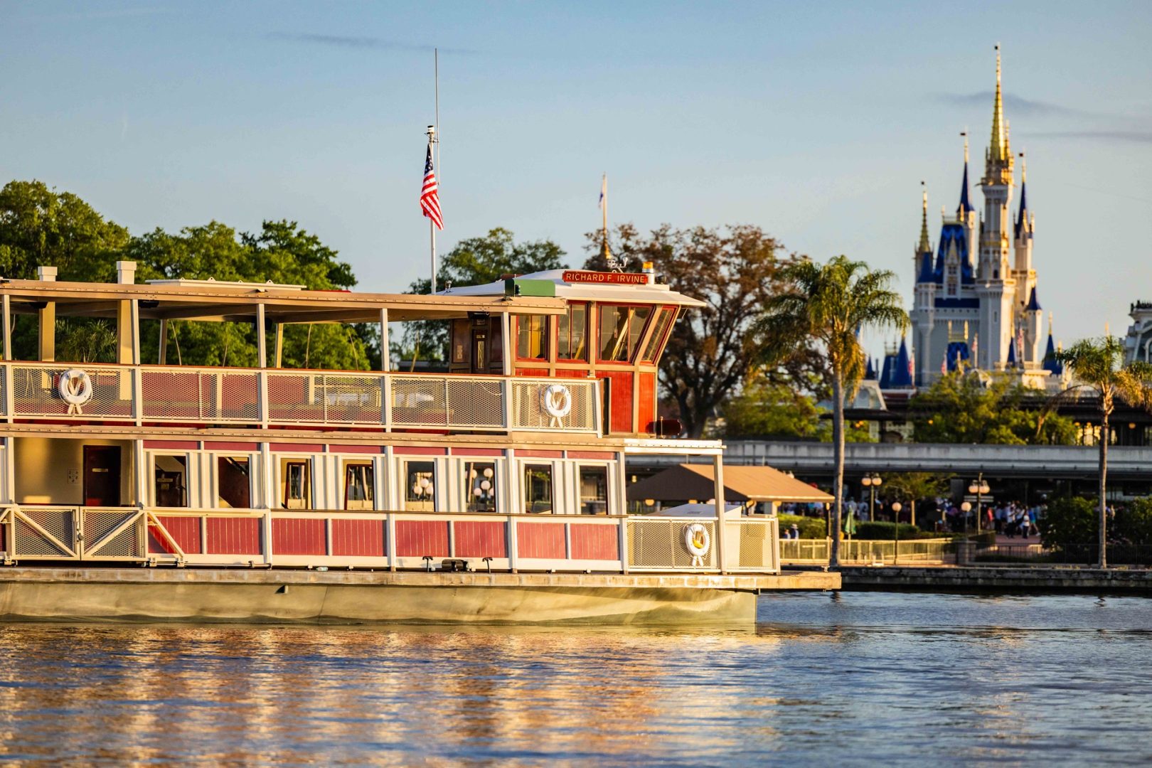 Disney World ferryboat crossing Seven Seas Lagoon with Cinderella Castle behind it