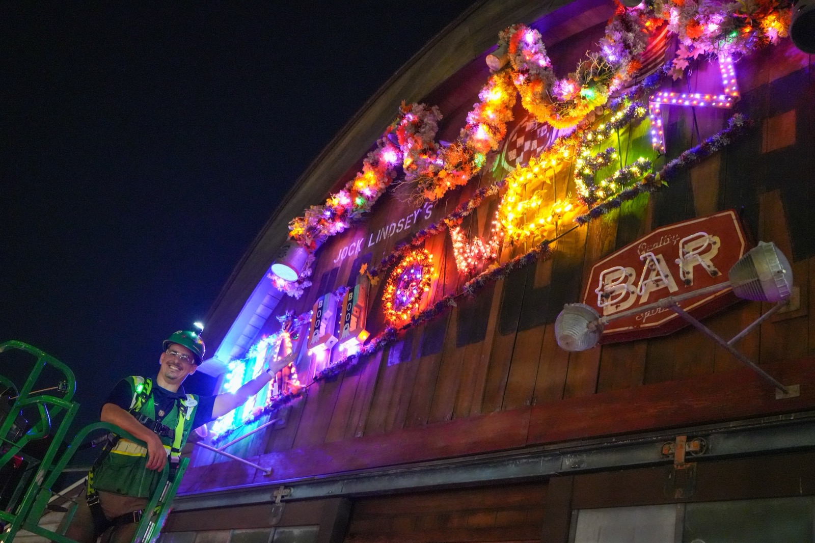 A cast member works on the Halloween overlay at Jock Lindsey’s Hangar Bar