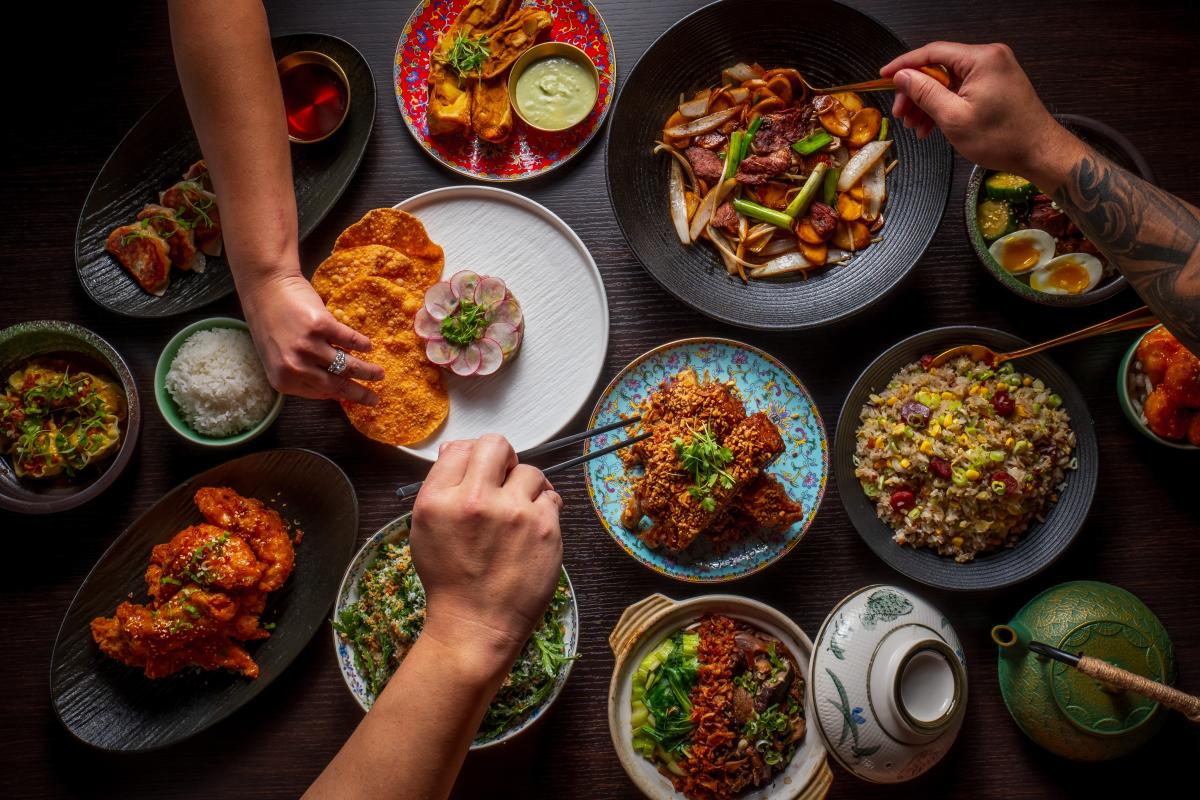 A table filled with dishes for Visit Orlando's Magical Dining