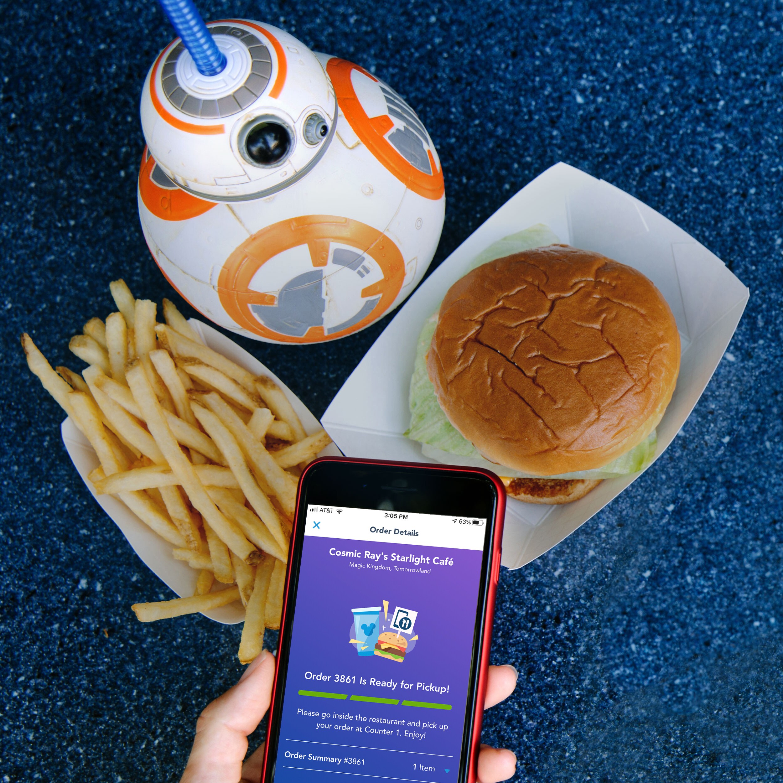Mobile order ready screen beside a Star Wars-themed meal