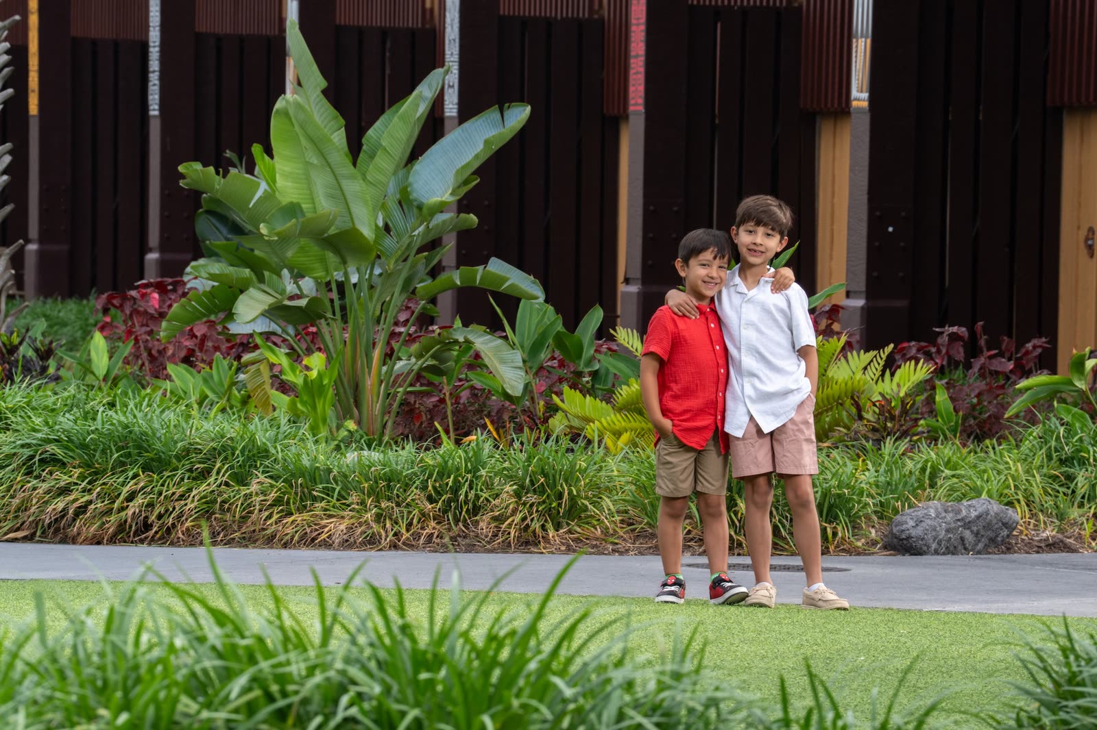 Two children pose for a Disney PhotoPass picture at a Walt Disney World resort