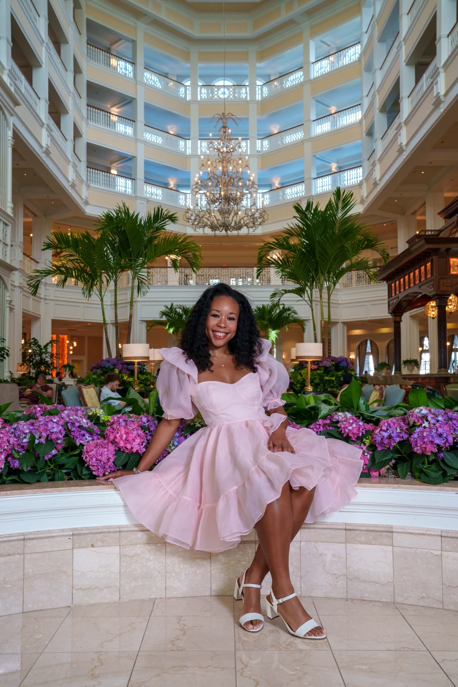 A guest poses during a Signature Portrait Session at Disney's Grand Floridian Resort