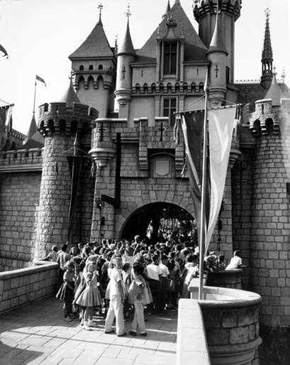 Children wait behind Sleeping Beauty Castle before entering Fantasyland