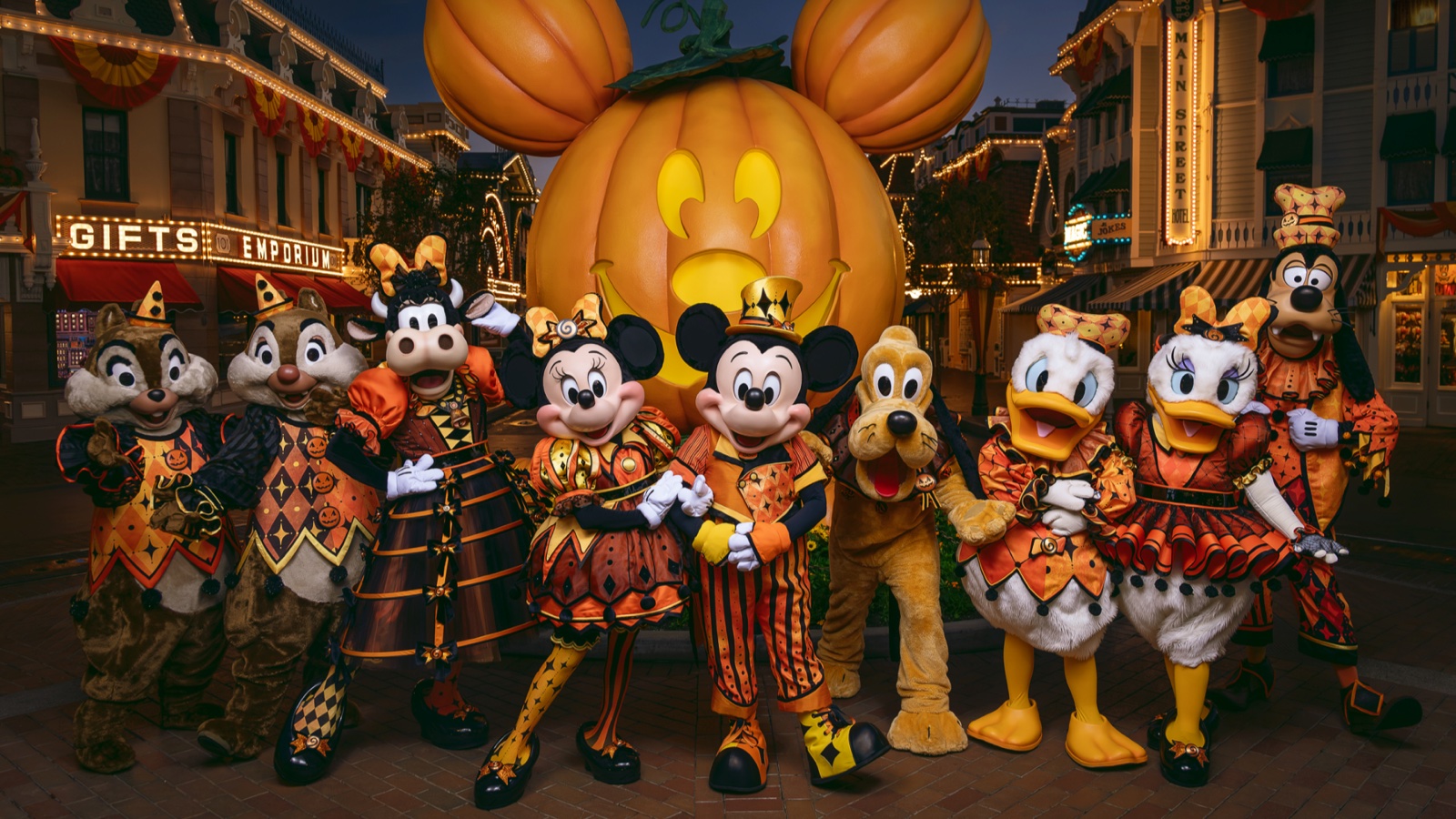 Disney characters in new Halloween costumes on Main Street at Disneyland