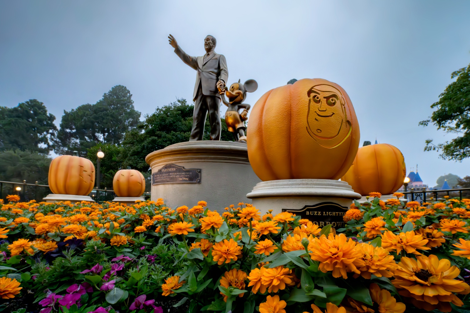 Character pumpkins around the Partners statue at Disneyland
