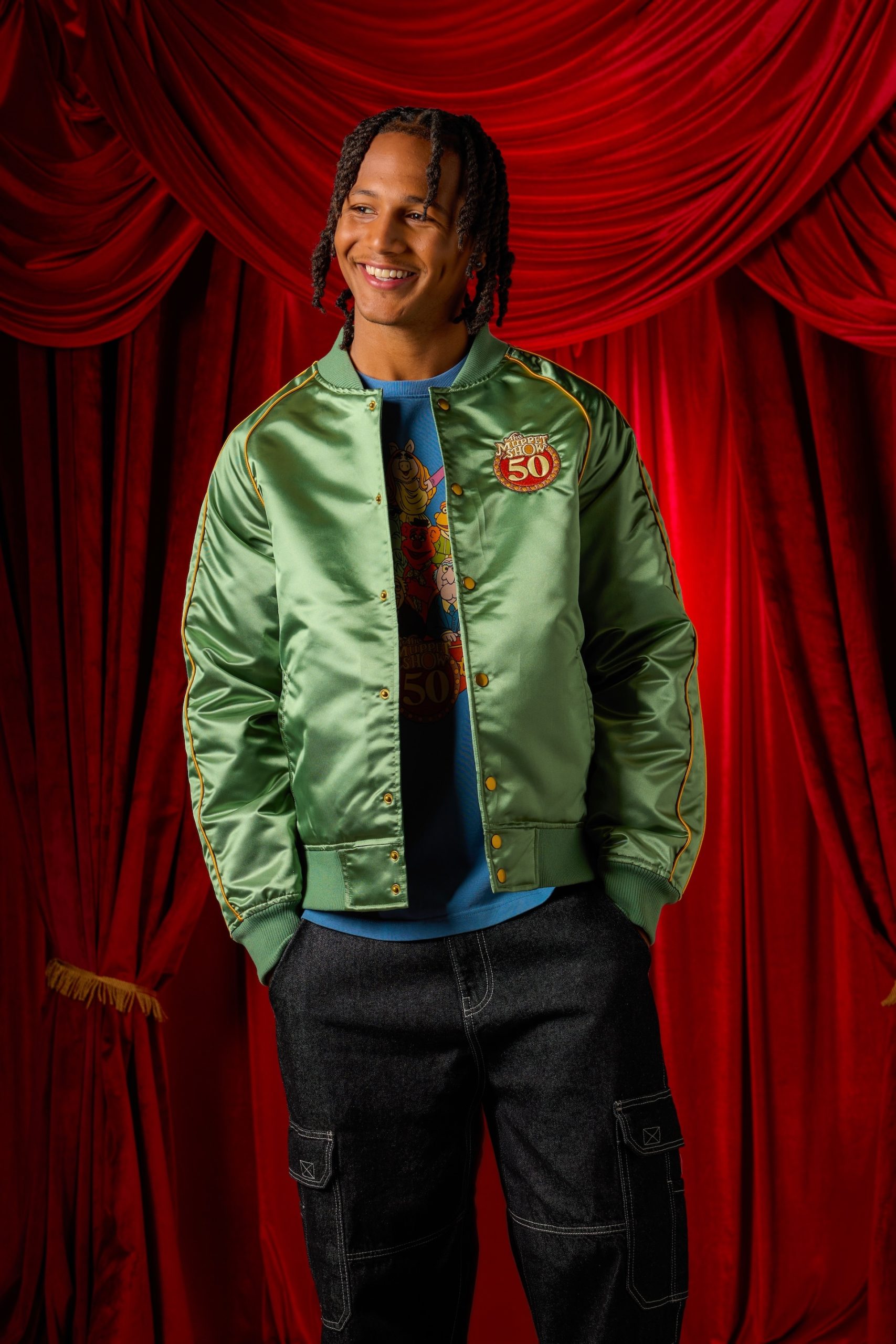 Green satin The Muppet Show 50th Anniversary jacket shown on a model