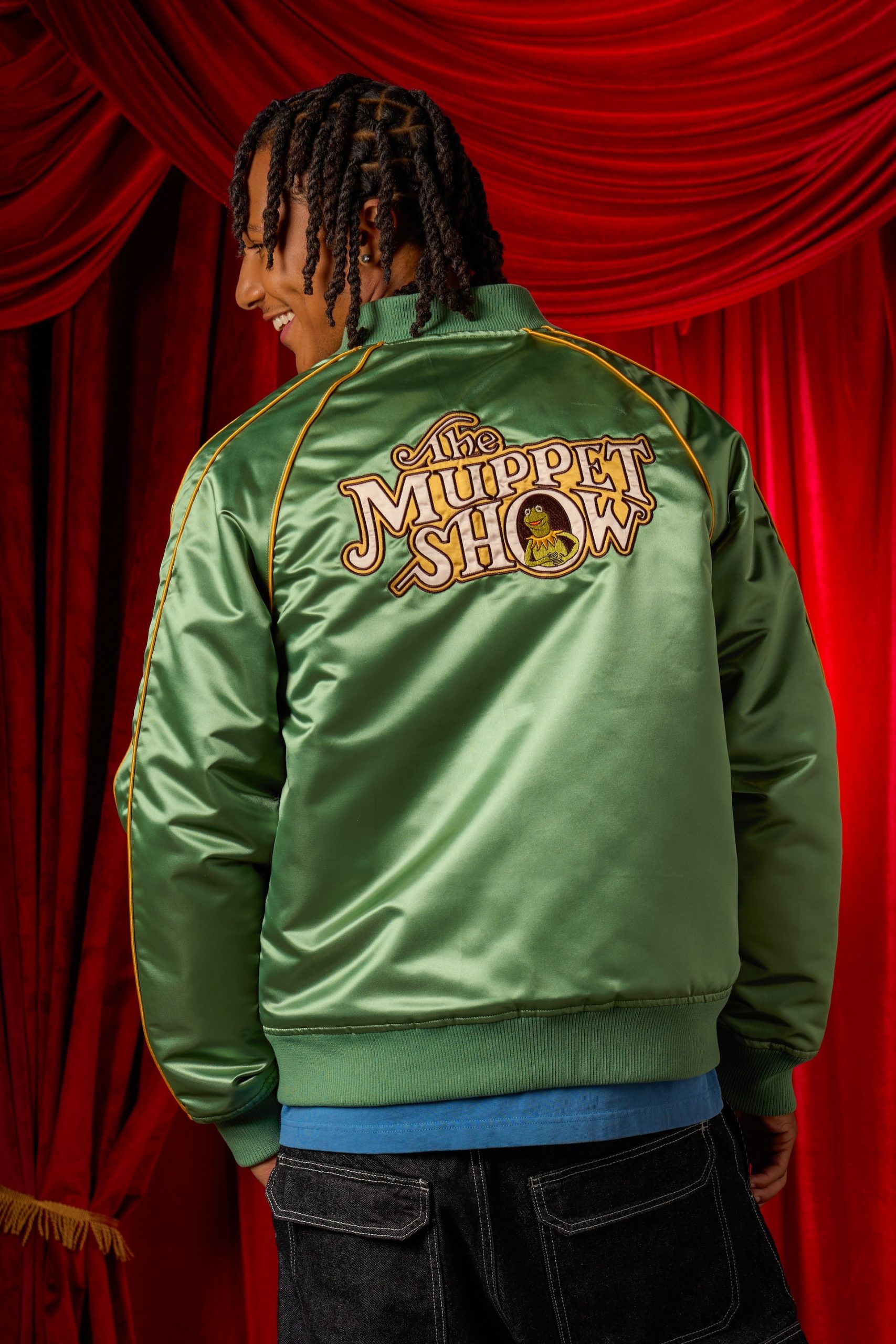Back of the green satin The Muppet Show 50th Anniversary jacket with Kermit artwork