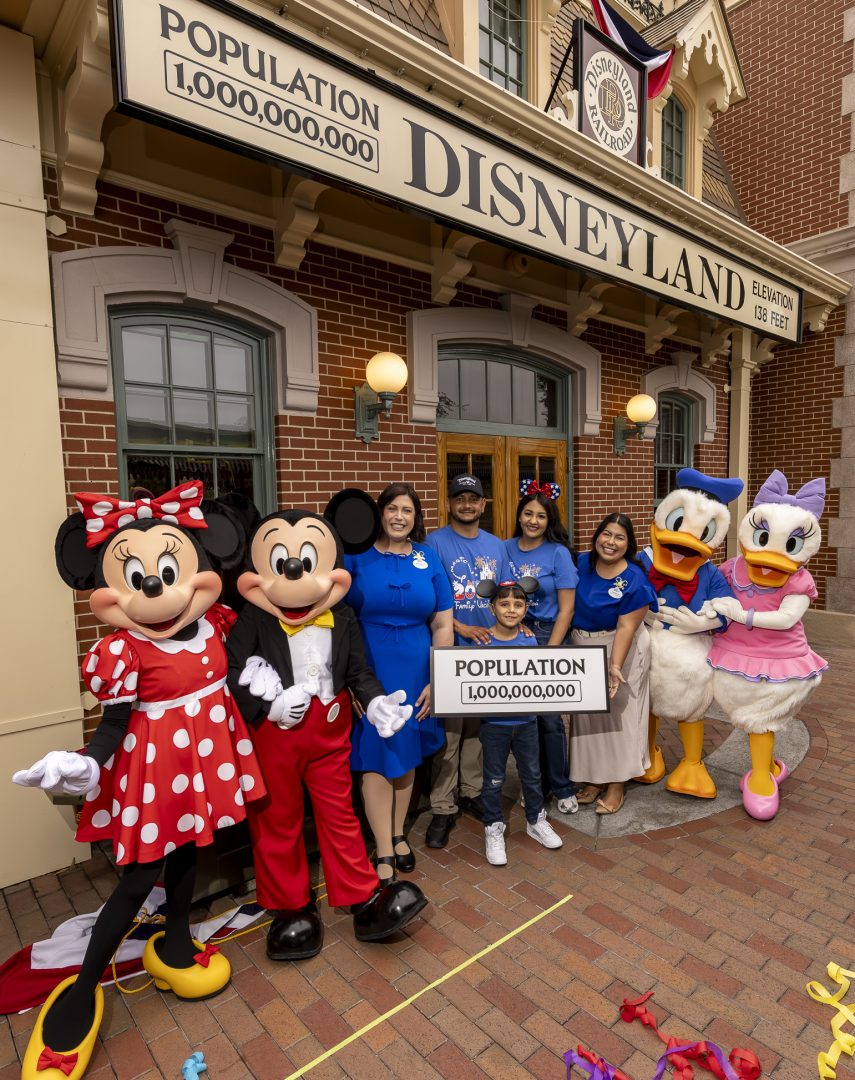 The Robles family with Mickey Mouse, Minnie Mouse, Donald Duck, Daisy Duck, and Disney Ambassadors