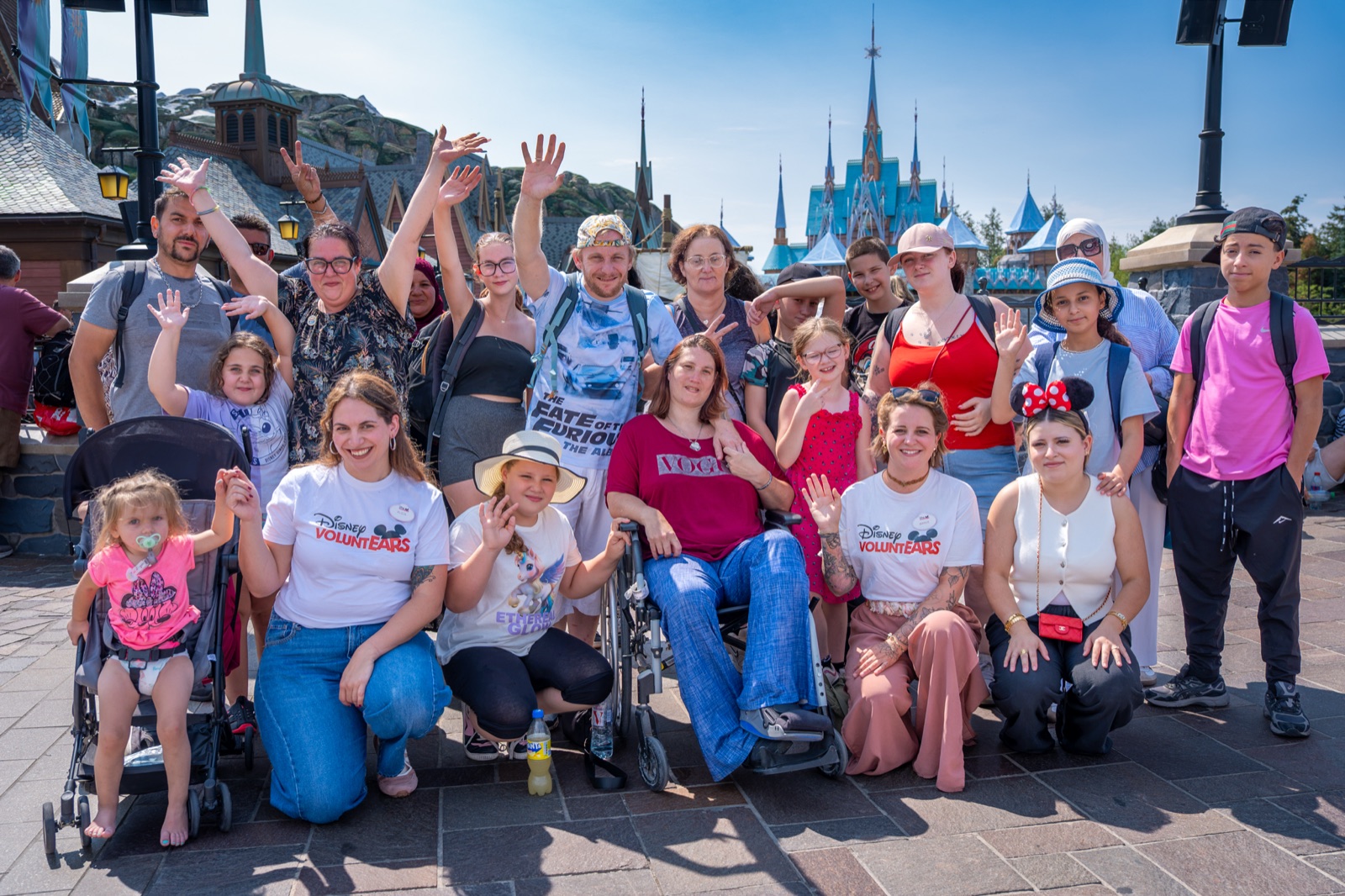 Children and families pose in Disneyland Park during a Disneyland Paris community visit
