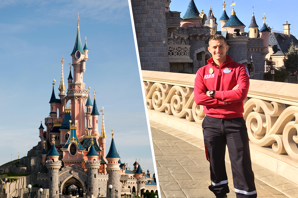 A Disneyland Paris Fire and Rescue team member beside Sleeping Beauty Castle