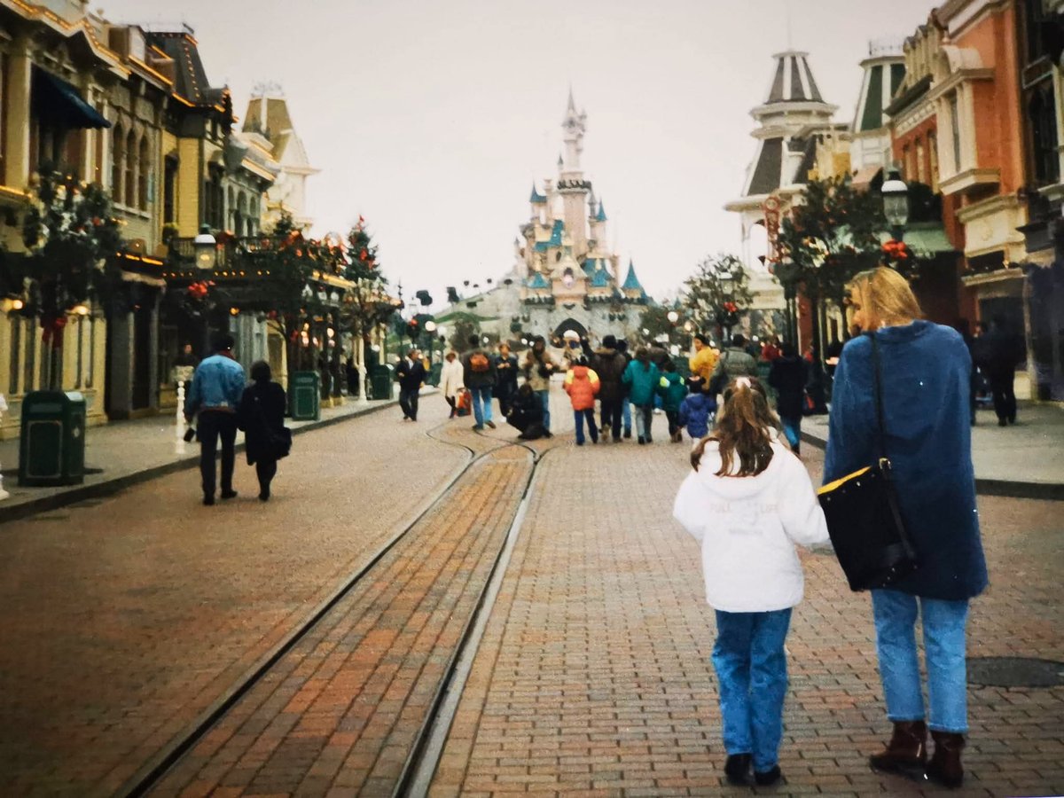 Anne-Lise walks down Main Street, U.S.A. toward Sleeping Beauty Castle during her first Disneyland Paris visit
