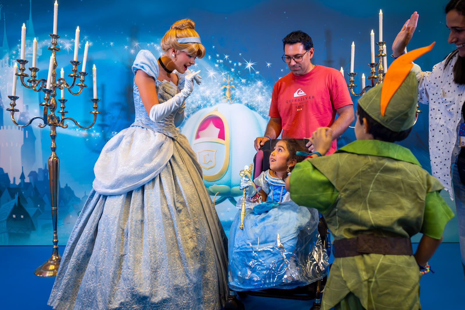 Cinderella welcomes a child during a Disneyland Paris Make-A-Wish visit