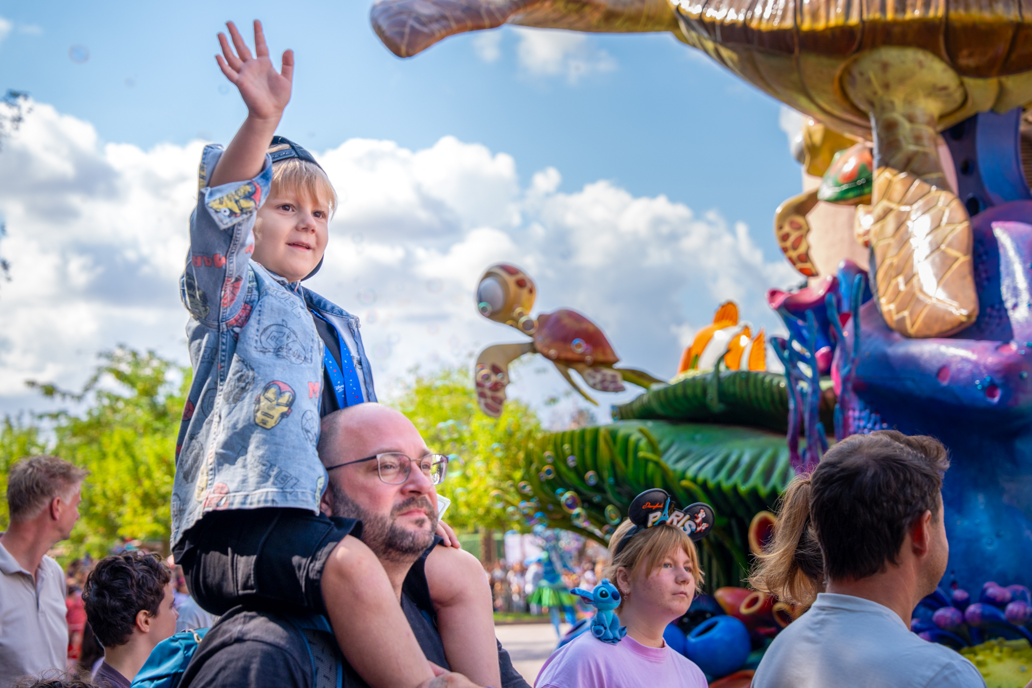 A child and family member explore Disneyland Paris during the Make-A-Wish visit